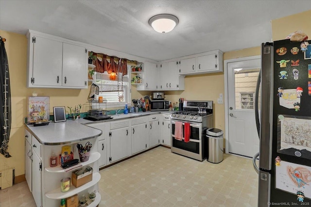 118 W Hartford Rd, Newington, CT 06111 - kitchen featuring open shelves, stainless steel appliances, light countertops, and white cabinetry