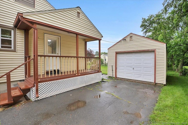 118 W Hartford Rd, Newington, CT 06111 - detached garage featuring driveway and a porch