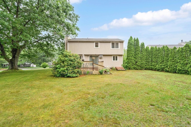17 Landing Cir, Windsor, CT 06095 - rear view of property featuring a wooden deck, a lawn, and a chimney