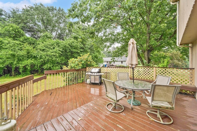 17 Landing Cir, Windsor, CT 06095 - deck with outdoor dining area, grilling area, and view of wooded area