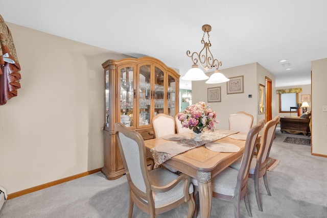 17 Landing Cir, Windsor, CT 06095 - dining area featuring light colored carpet and a baseboard heating unit