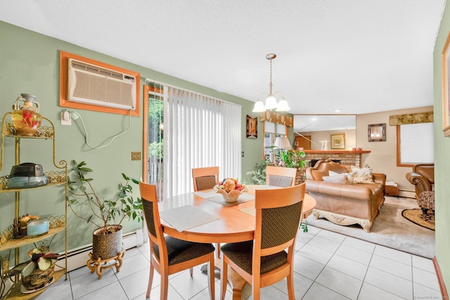 17 Landing Cir, Windsor, CT 06095 - dining space featuring a wall mounted AC, a chandelier, light tile patterned floors, and a baseboard radiator