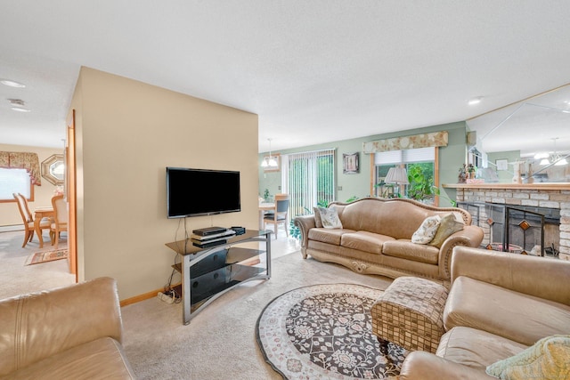 17 Landing Cir, Windsor, CT 06095 - carpeted living room with a chandelier and a brick fireplace