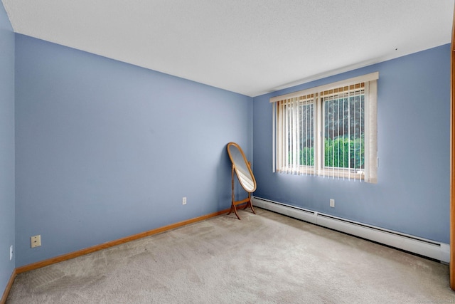 17 Landing Cir, Windsor, CT 06095 - empty room featuring a baseboard heating unit and carpet flooring
