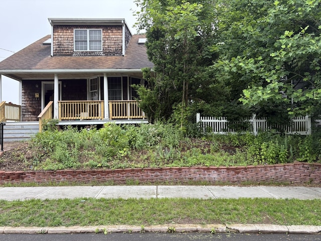 91 Hyde St, New Haven, CT 06512 - view of front of home with covered porch and a shingled roof
