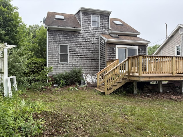 91 Hyde St, New Haven, CT 06512 - rear view of property featuring a deck, a shingled roof, and a yard
