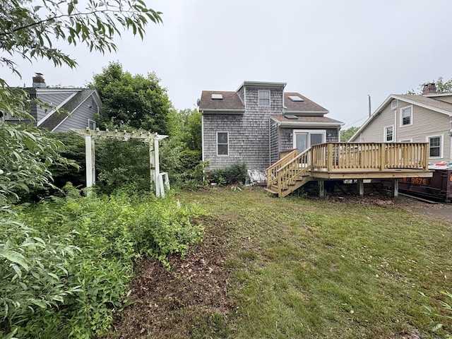 91 Hyde St, New Haven, CT 06512 - back of property with a deck, a lawn, and roof with shingles