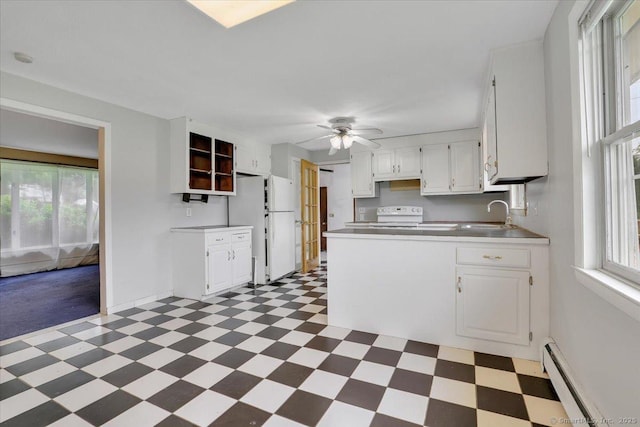 401 Berlin St, Southington, CT 06489 - kitchen with light floors, electric stove, white cabinetry, a ceiling fan, and a peninsula