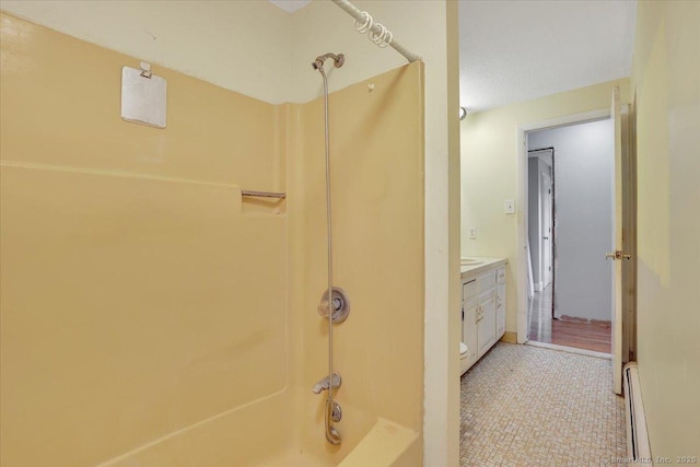 401 Berlin St, Southington, CT 06489 - bathroom featuring bathing tub / shower combination, vanity, and a baseboard radiator
