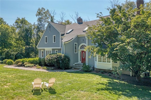 26 Ruscoe Rd, Wilton, CT 06897 - view of front of home with a chimney, a front lawn, and roof with shingles