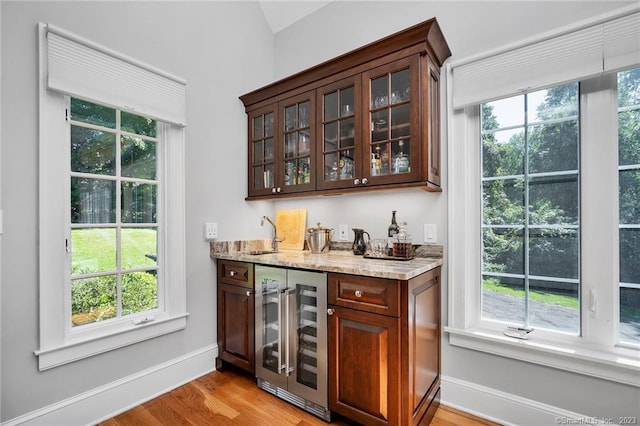 26 Ruscoe Rd, Wilton, CT 06897 - indoor wet bar with wine cooler, light wood-style floors, plenty of natural light, and lofted ceiling