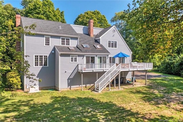 26 Ruscoe Rd, Wilton, CT 06897 - rear view of house with stairs, a chimney, a wooden deck, a lawn, and a shingled roof