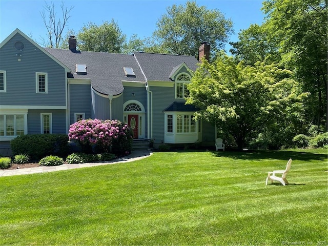 26 Ruscoe Rd, Wilton, CT 06897 - view of front of property featuring a chimney, a front yard, and roof with shingles