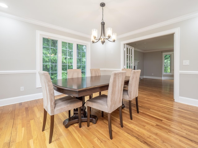 26 Ruscoe Rd, Wilton, CT 06897 - dining area featuring a chandelier, plenty of natural light, light wood-style flooring, and ornamental molding