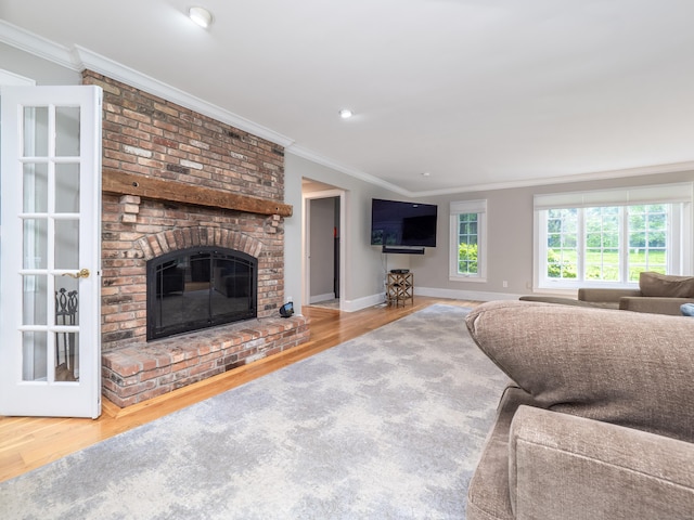26 Ruscoe Rd, Wilton, CT 06897 - living room with crown molding, wood finished floors, a brick fireplace, and recessed lighting