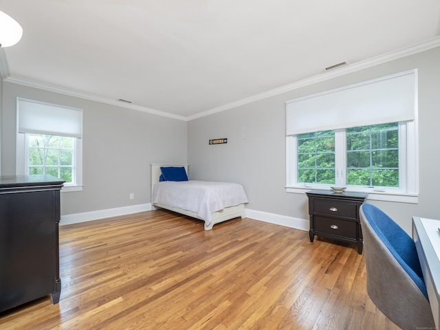 26 Ruscoe Rd, Wilton, CT 06897 - bedroom featuring light wood finished floors and crown molding