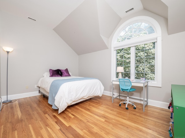26 Ruscoe Rd, Wilton, CT 06897 - bedroom with vaulted ceiling and light wood-style flooring