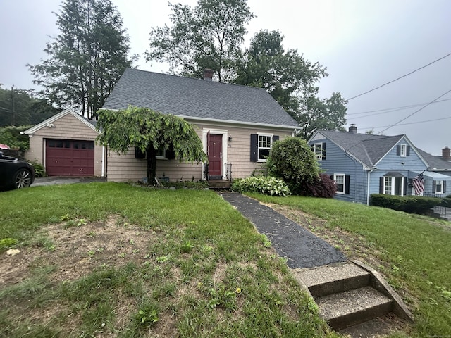58 Eggleston St, Torrington, CT 06790 - view of front of house with a front lawn, roof with shingles, a chimney, and a detached garage