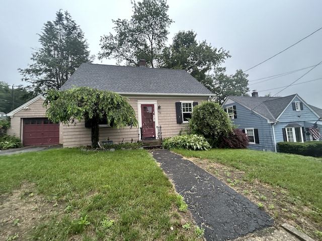 58 Eggleston St, Torrington, CT 06790 - view of front of property with a front yard, a shingled roof, a chimney, and a garage