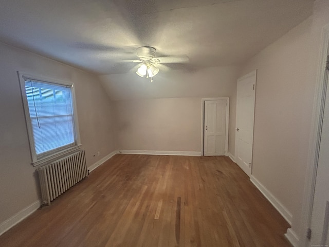 58 Eggleston St, Torrington, CT 06790 - additional living space with radiator, wood finished floors, ceiling fan, and lofted ceiling