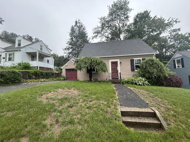 58 Eggleston St, Torrington, CT 06790 - view of front of home featuring a front lawn and a garage