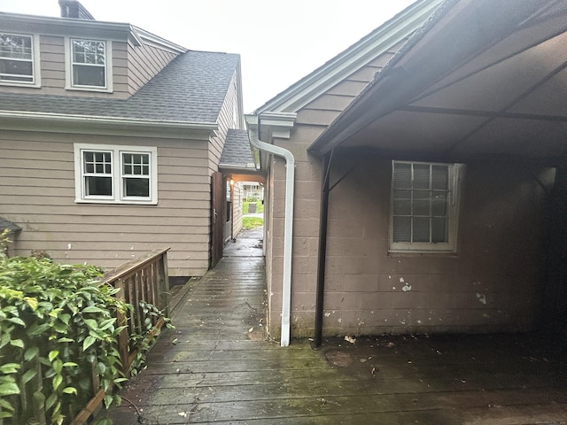 58 Eggleston St, Torrington, CT 06790 - doorway to property featuring roof with shingles and a deck