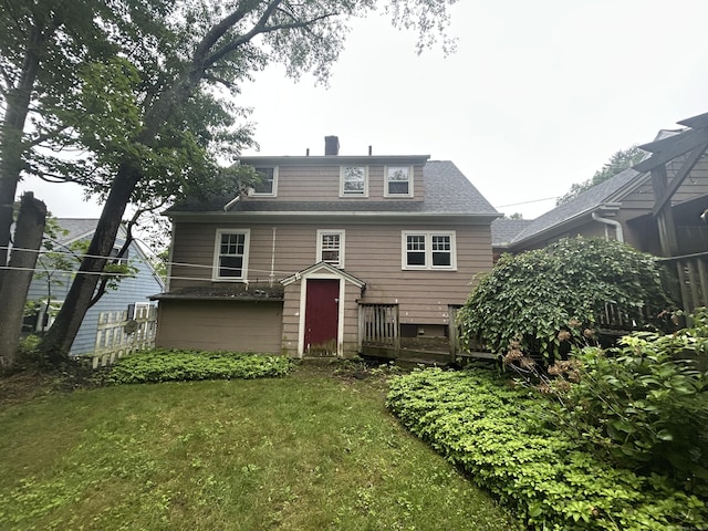 58 Eggleston St, Torrington, CT 06790 - rear view of property featuring a yard and a shingled roof