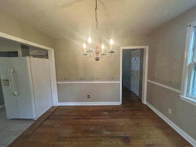 58 Eggleston St, Torrington, CT 06790 - unfurnished dining area featuring wood finished floors and a chandelier