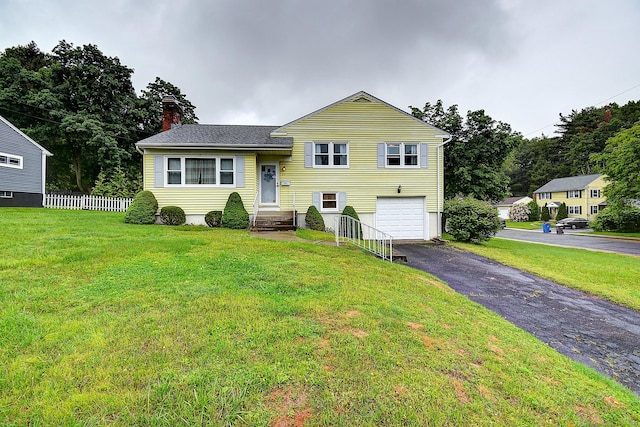 47 Hoffman Rd, Manchester, CT 06042 - tri-level home with an attached garage, driveway, and a chimney
