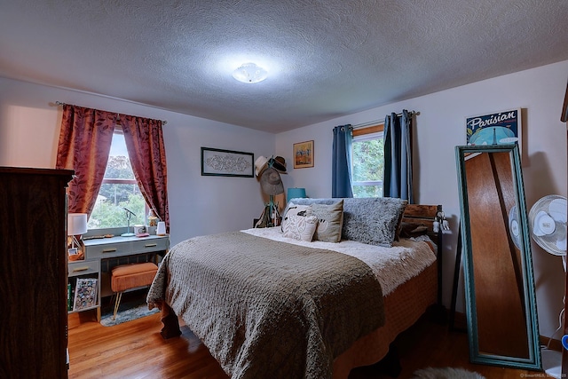 47 Hoffman Rd, Manchester, CT 06042 - bedroom with wood finished floors and a textured ceiling