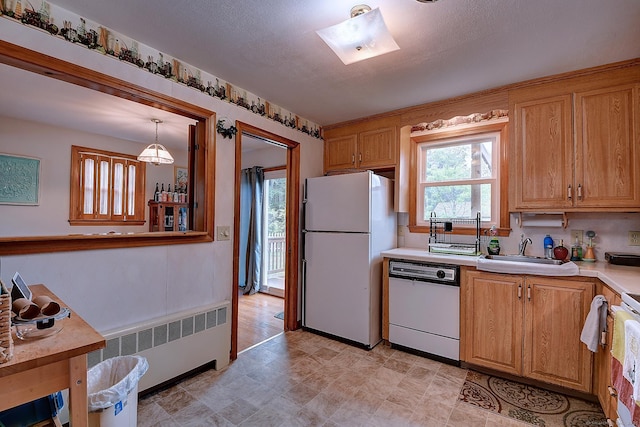 47 Hoffman Rd, Manchester, CT 06042 - kitchen with white appliances, radiator, light countertops, and a skylight