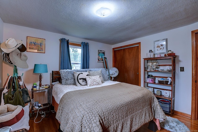 47 Hoffman Rd, Manchester, CT 06042 - bedroom featuring wood finished floors, a closet, and a textured ceiling