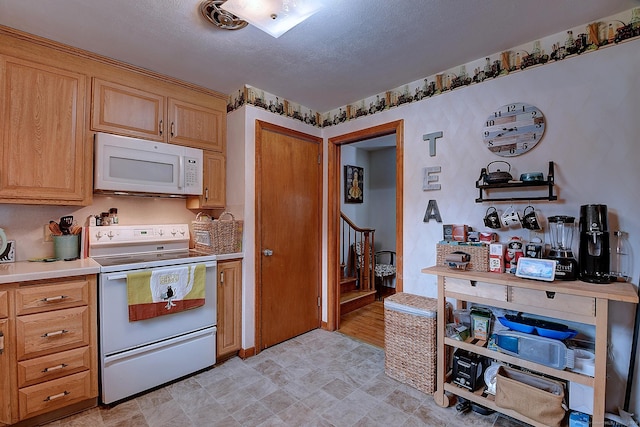 47 Hoffman Rd, Manchester, CT 06042 - kitchen featuring white appliances, a textured ceiling, and light countertops