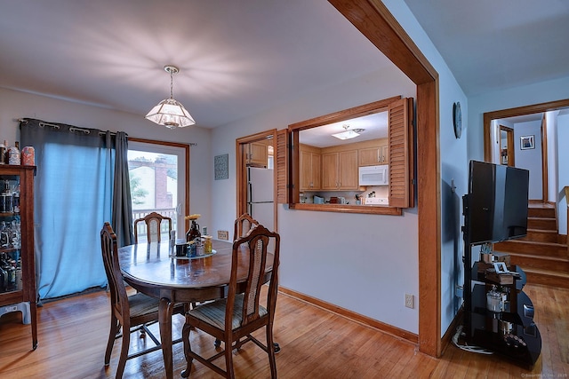 47 Hoffman Rd, Manchester, CT 06042 - dining room with light wood-style flooring and baseboards