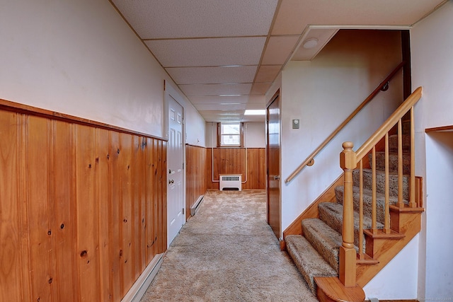 47 Hoffman Rd, Manchester, CT 06042 - basement featuring stairway, a wainscoted wall, wooden walls, carpet floors, and a drop ceiling