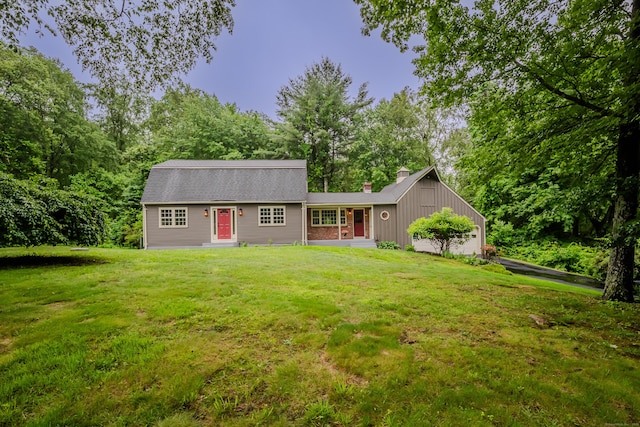 34 Roberts Rd, Marlborough, CT 06447 - colonial inspired home with a front lawn, a chimney, and entry steps