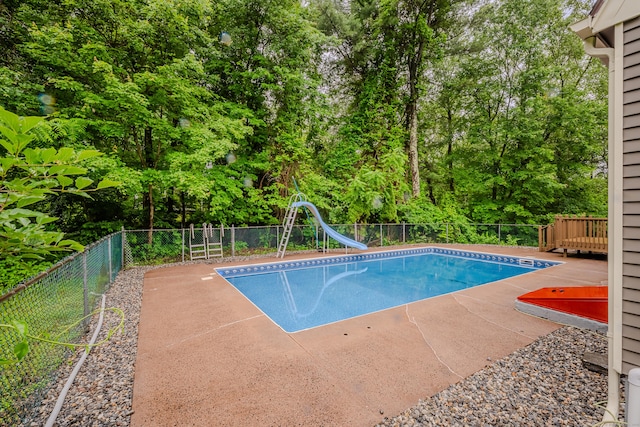 34 Roberts Rd, Marlborough, CT 06447 - view of swimming pool with a water slide, a fenced backyard, a patio area, and view of scattered trees