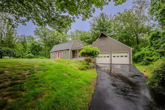 34 Roberts Rd, Marlborough, CT 06447 - view of front of home featuring a front yard, a detached garage, and a gambrel roof