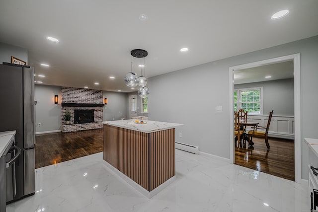 34 Roberts Rd, Marlborough, CT 06447 - kitchen with a baseboard heating unit, a fireplace, freestanding refrigerator, recessed lighting, and light marble finish floors
