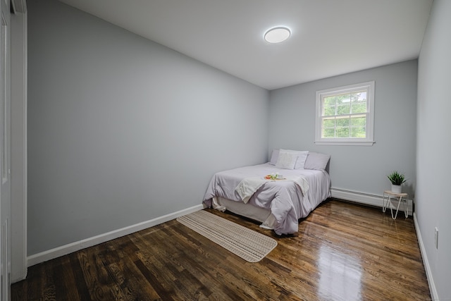 34 Roberts Rd, Marlborough, CT 06447 - bedroom featuring a baseboard heating unit and wood finished floors