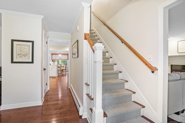 112 Greenbrier Rd, Trumbull, CT 06611 - stairs with a baseboard radiator, wood finished floors, and ornamental molding