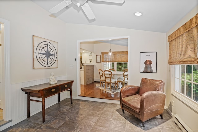 112 Greenbrier Rd, Trumbull, CT 06611 - sitting room with a baseboard heating unit, vaulted ceiling, ceiling fan, healthy amount of natural light, and wainscoting
