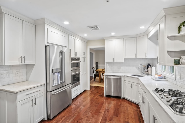 112 Greenbrier Rd, Trumbull, CT 06611 - kitchen with appliances with stainless steel finishes, white cabinets, decorative backsplash, recessed lighting, and dark wood finished floors
