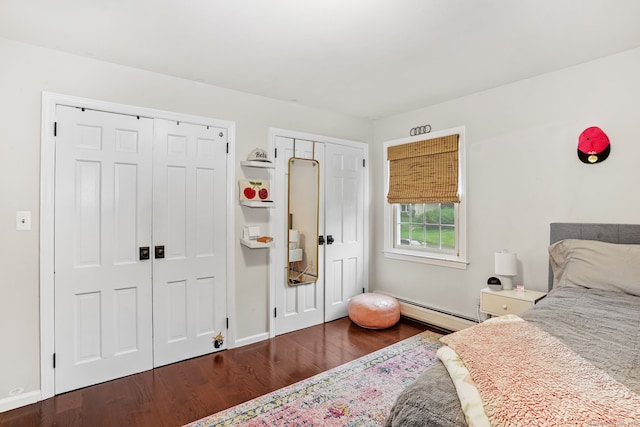 112 Greenbrier Rd, Trumbull, CT 06611 - bedroom with a baseboard heating unit, two closets, and wood finished floors