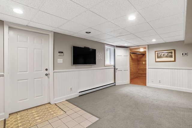 112 Greenbrier Rd, Trumbull, CT 06611 - unfurnished living room featuring a baseboard heating unit, wainscoting, recessed lighting, and a paneled ceiling