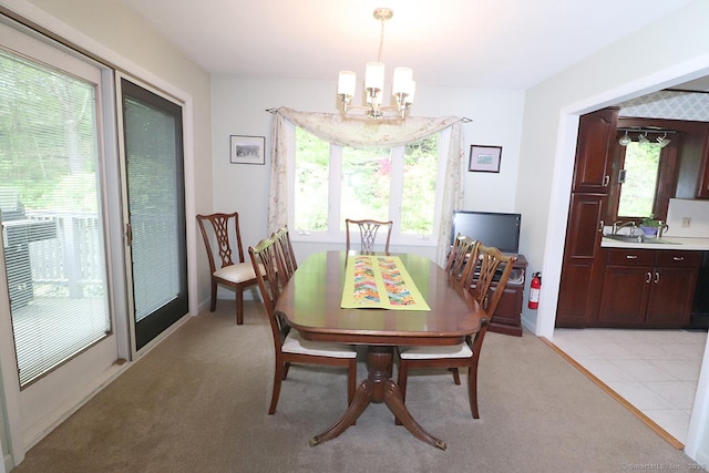 204 W Hill Rd, New Hartford, CT 06057 - dining room featuring a chandelier and light carpet