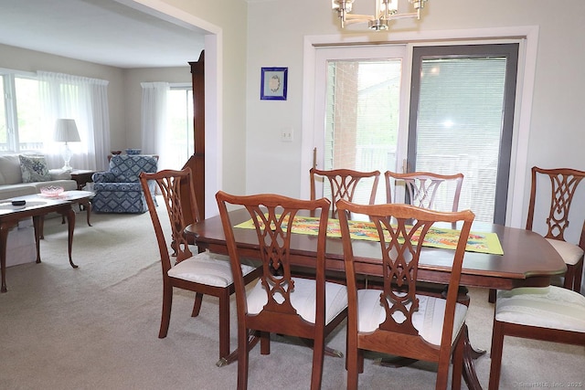 204 W Hill Rd, New Hartford, CT 06057 - dining area with light colored carpet and a chandelier