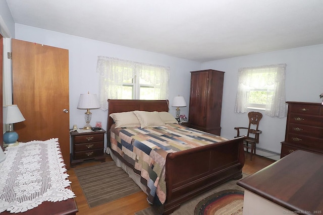 204 W Hill Rd, New Hartford, CT 06057 - bedroom with wood finished floors and a baseboard radiator