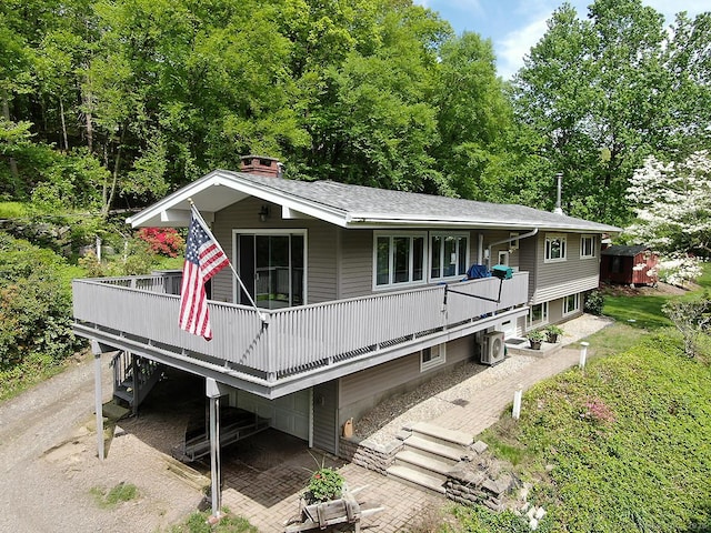 204 W Hill Rd, New Hartford, CT 06057 - view of front facade with a wooden deck, a chimney, and a shingled roof
