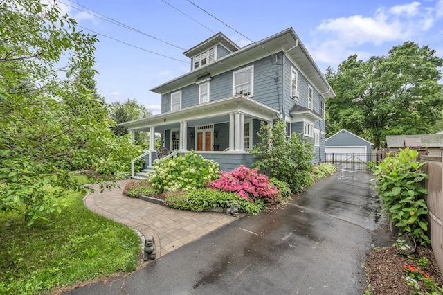 95 Parsons St, Wallingford, CT 06492 - traditional style home featuring a porch, a detached garage, and an outbuilding